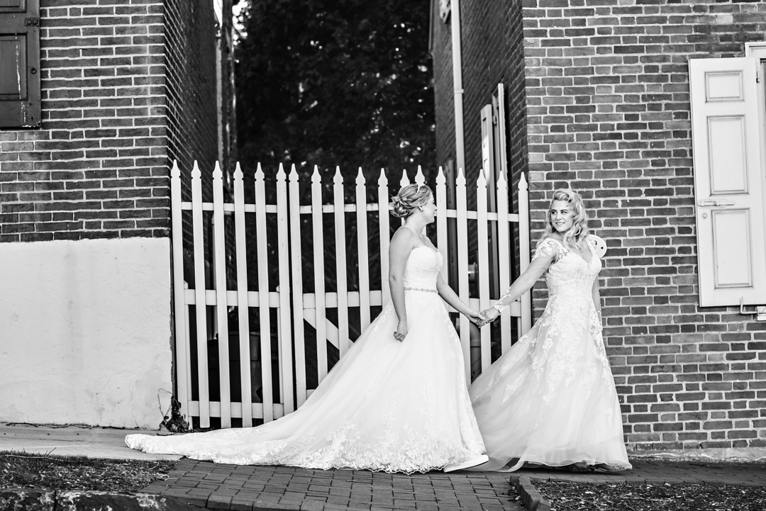 Two brides walk the historic streets of Bethlehem before getting married at Hotel Bethlehem.